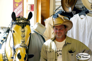 Mike trying on hats in Deadwood, SD | Photo by BackroadsVanner.com